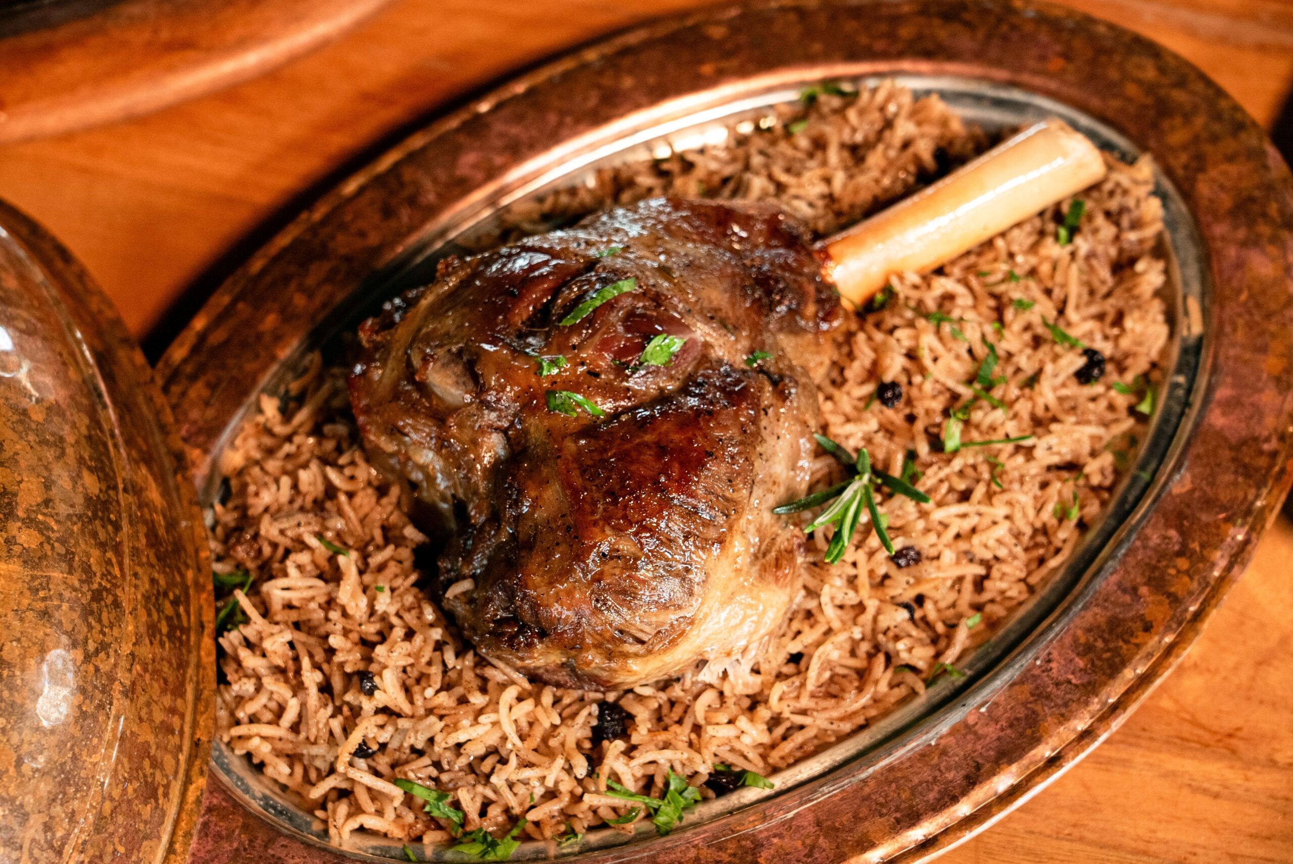 Juicy lamb shank served on a bed of aromatic spiced rice.